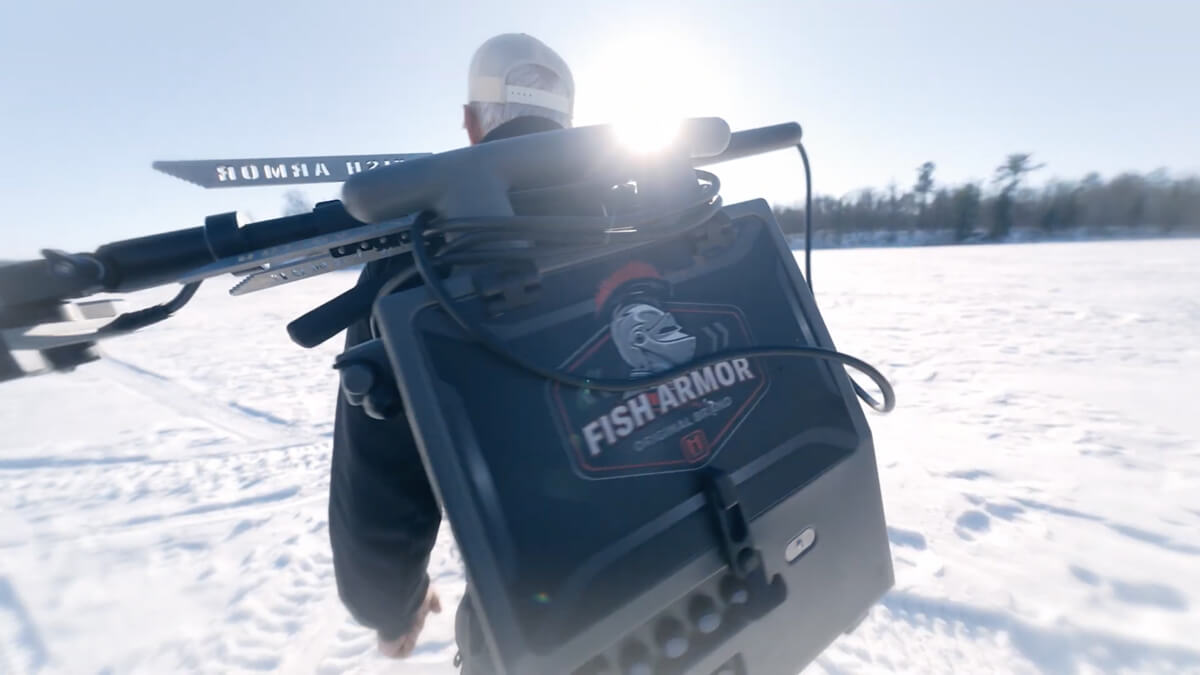 Load video: Brad Kolstad demonstrating Fish Armor shuttle systems including Pro Extreme, Pro Lite, and Pro Pole for transporting Garmin, Humminbird, and Lowrance forward-facing sonar units between ice and open water fishing