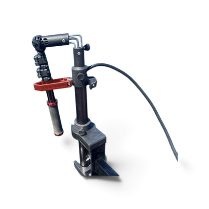 Twist Handle mounted on a pole with the handle folded into the red storage clip