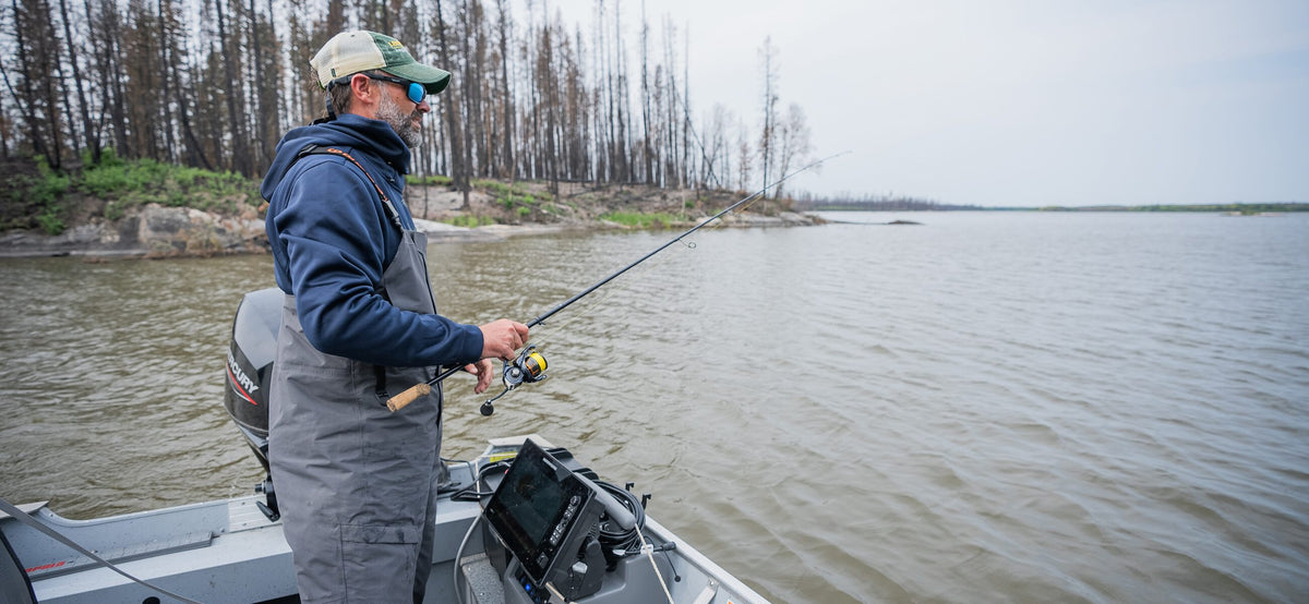 Angler casting from a boat with a Fish Armor shuttle on board