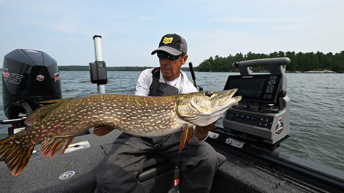 Load video: Brad Kolstad demonstrating Fish Armor shuttle systems including Pro Extreme, Pro Lite, and Pro Pole for transporting Garmin, Humminbird, and Lowrance forward-facing sonar units between ice and open water fishing